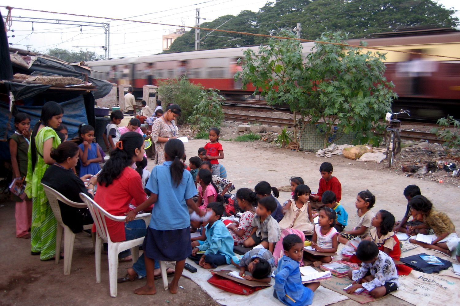 Touching Lives team visiting a slum community in Mumbai