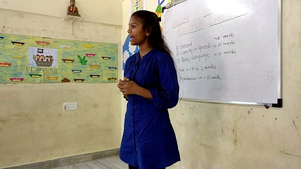 Jyoti as a young student, speaking at a Touching Lives event