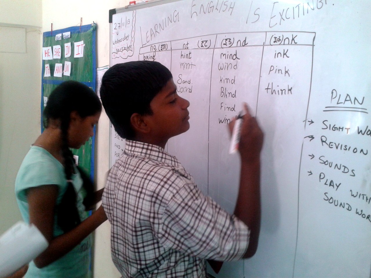 Raj as a boy, learning English at the Touching Lives Learning Center