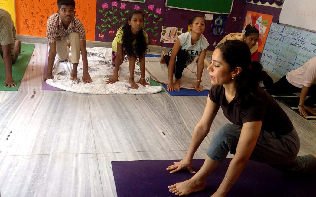 A child absorbed in a craft activity in the Care program