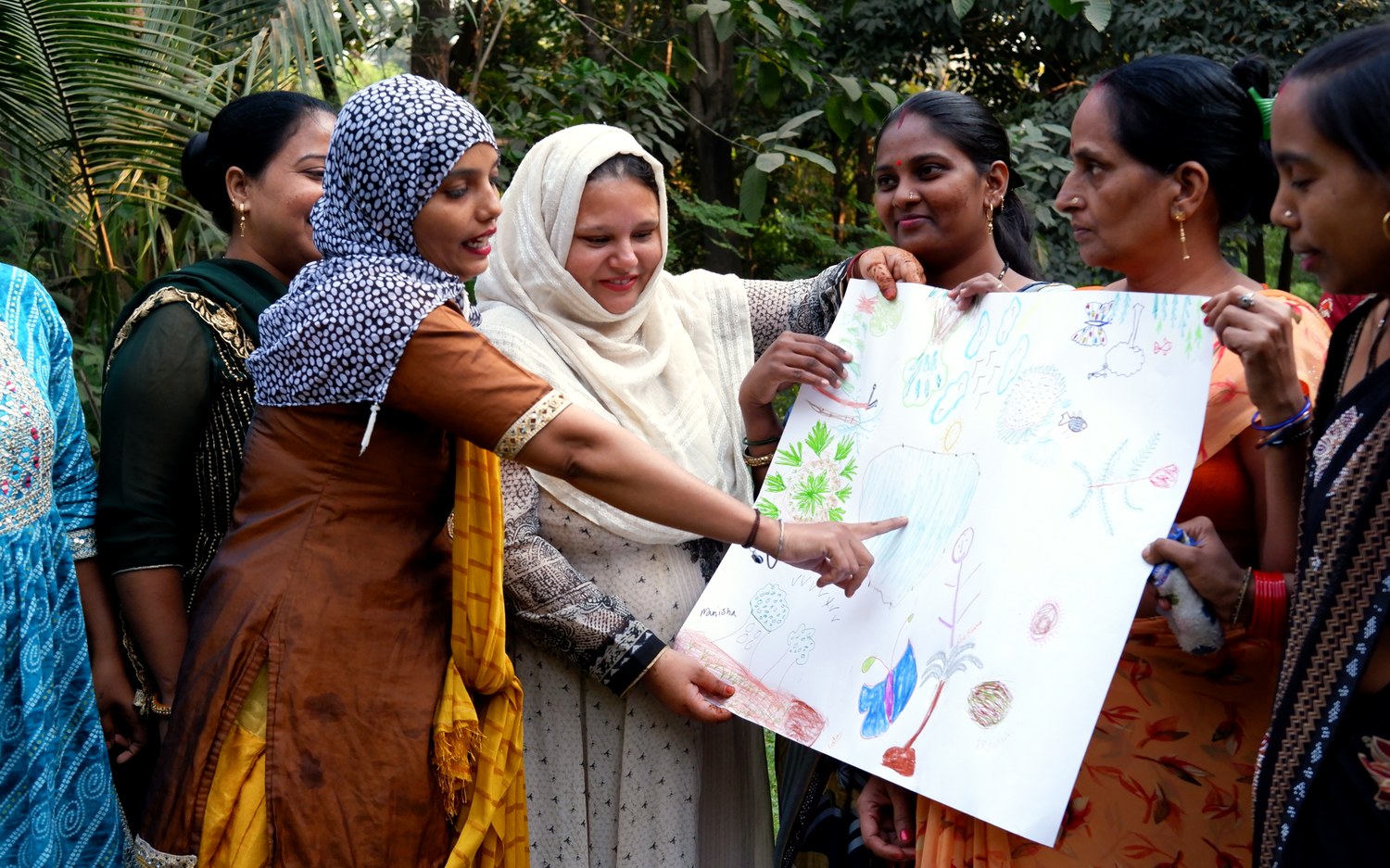 Mothers sharing their artwork at a Touching Lives healing circle